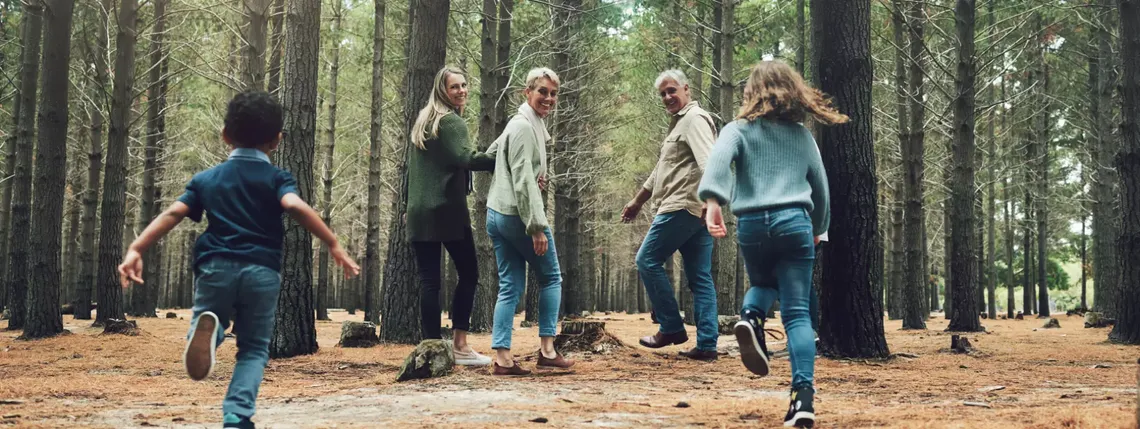 family outside walking in the forest