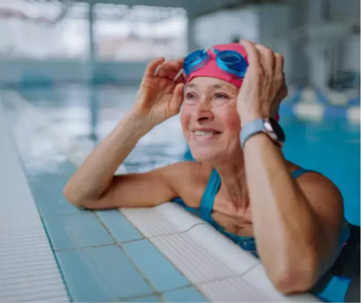 senior woman smiling in pool