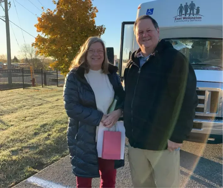 volunteers outside a bus